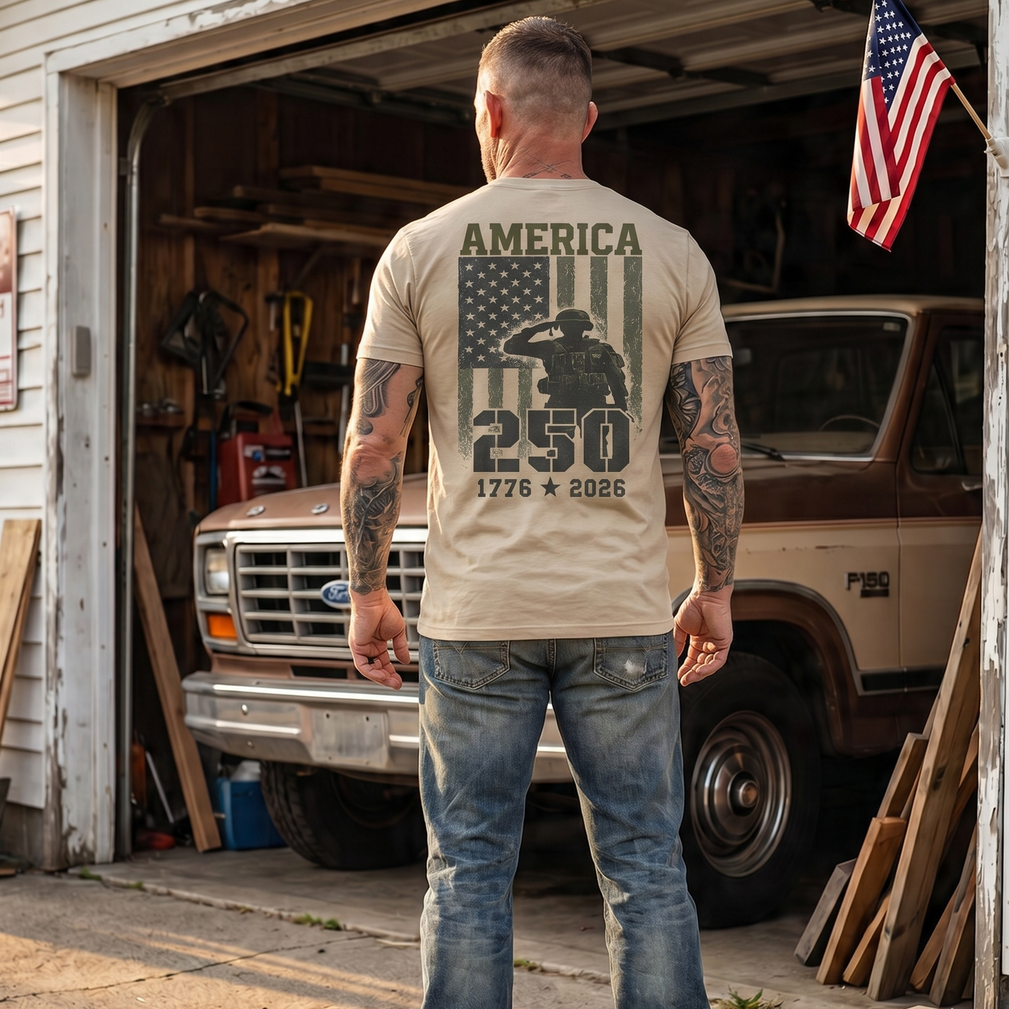 Man wearing a patriotic “America 250” graphic t-shirt featuring a saluting soldier in front of an American flag with the years 1776–2026. Patriotic apparel celebrating America’s 250th anniversary, honoring military service, veterans, freedom, and American pride with a bold vintage-inspired design.