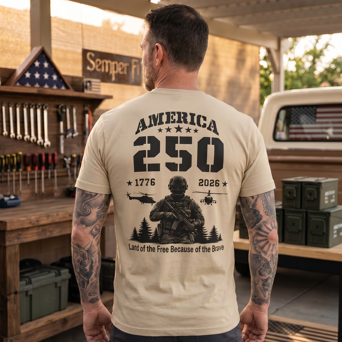Man wearing a patriotic “America 250” graphic t-shirt featuring a military soldier, helicopters, stars, and the years 1776–2026 with the phrase “Land of the Free Because of the Brave.” Bold patriotic apparel celebrating America’s 250th anniversary, military service, freedom, veterans, and American pride.