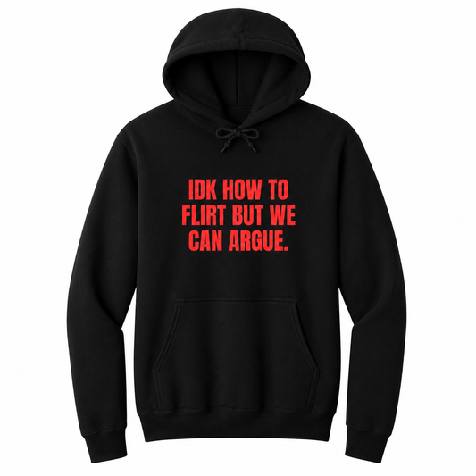 Front view of a black pullover hoodie featuring the bold red statement "IDK HOW TO FLIRT BUT WE CAN ARGUE." centered on the chest in large uppercase block lettering. The drawstrings are tied into a short bow above the design, creating a realistic product mockup. A funny sarcastic hoodie for adults with relationship humor, bold typography, and casual streetwear style.