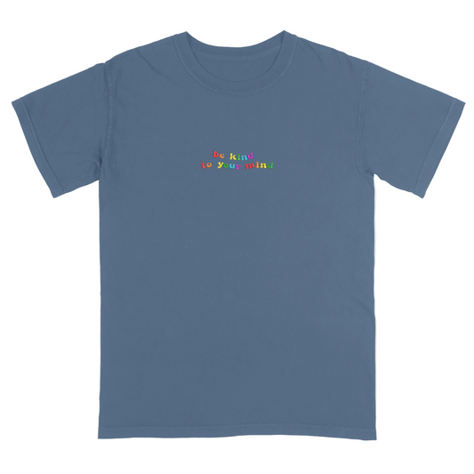Blue t-shirt with 'be kind to your mind' text in colorful letters on a white background