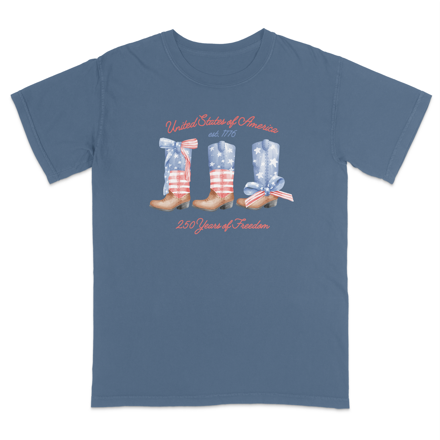 Blue Jean patriotic graphic tee featuring vintage American flag cowboy boots with “United States of America,” “Est. 1776,” and “250 Years of Freedom” text for a western-inspired Americana look.