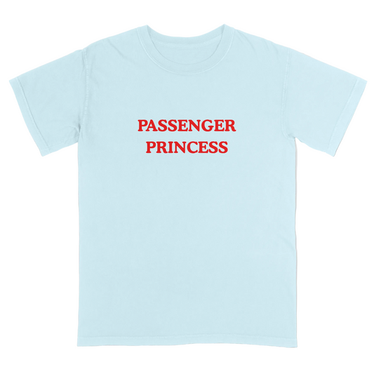 Light blue t-shirt with 'Passenger Princess' text in red on a light gray background