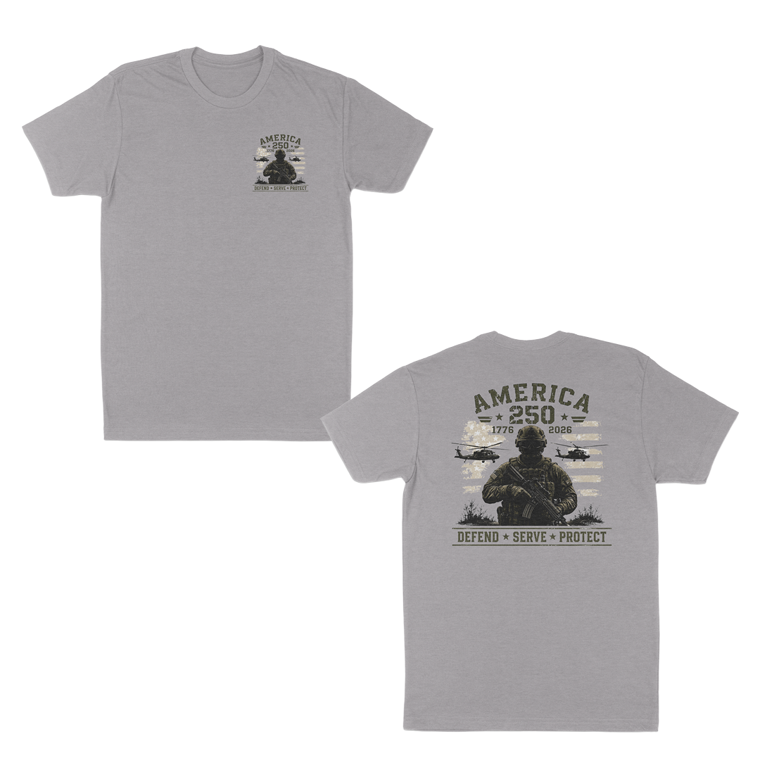 Heather grey patriotic military t-shirt featuring a small front chest graphic and large back print with armed soldier, helicopters, distressed American flag, “America 250” artwork, and “Defend • Serve • Protect” text.