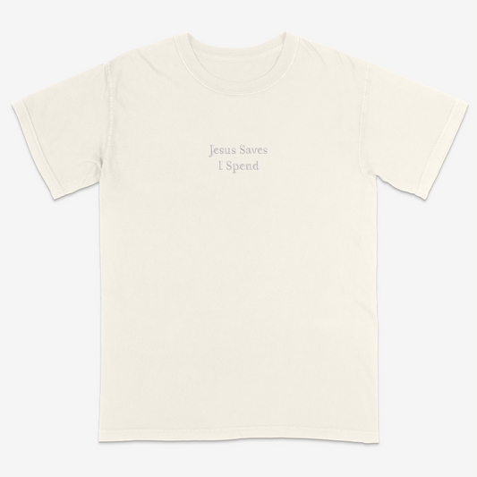 Ivory t-shirt with 'Jesus Saves I Spend' text on a white background