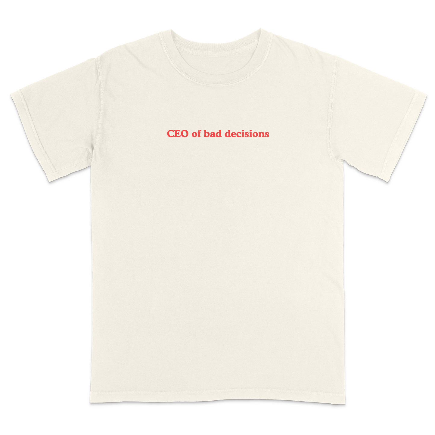 Front view of a ivory graphic T-shirt featuring the phrase "CEO of bad decisions" in small vintage-style red lettering centered on the chest. This minimalist humor tee offers a clean, trendy design that's perfect for casual everyday wear and sarcastic self-expression.