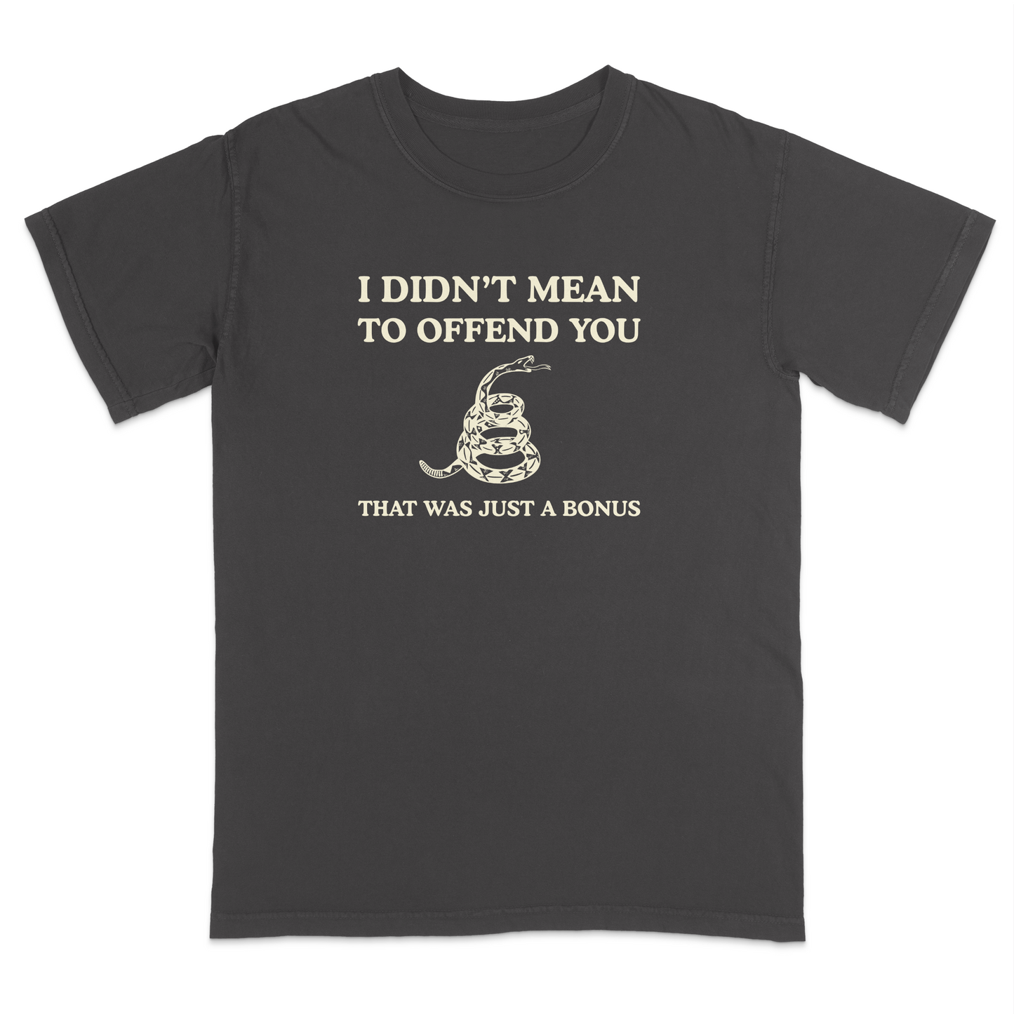 Front view of a pepper graphic T-shirt featuring the humorous phrase "I DIDN'T MEAN TO OFFEND YOU" above a coiled rattlesnake illustration and the text "THAT WAS JUST A BONUS." This vintage-inspired graphic tee combines bold typography with Western-style artwork for a funny, sarcastic everyday shirt.