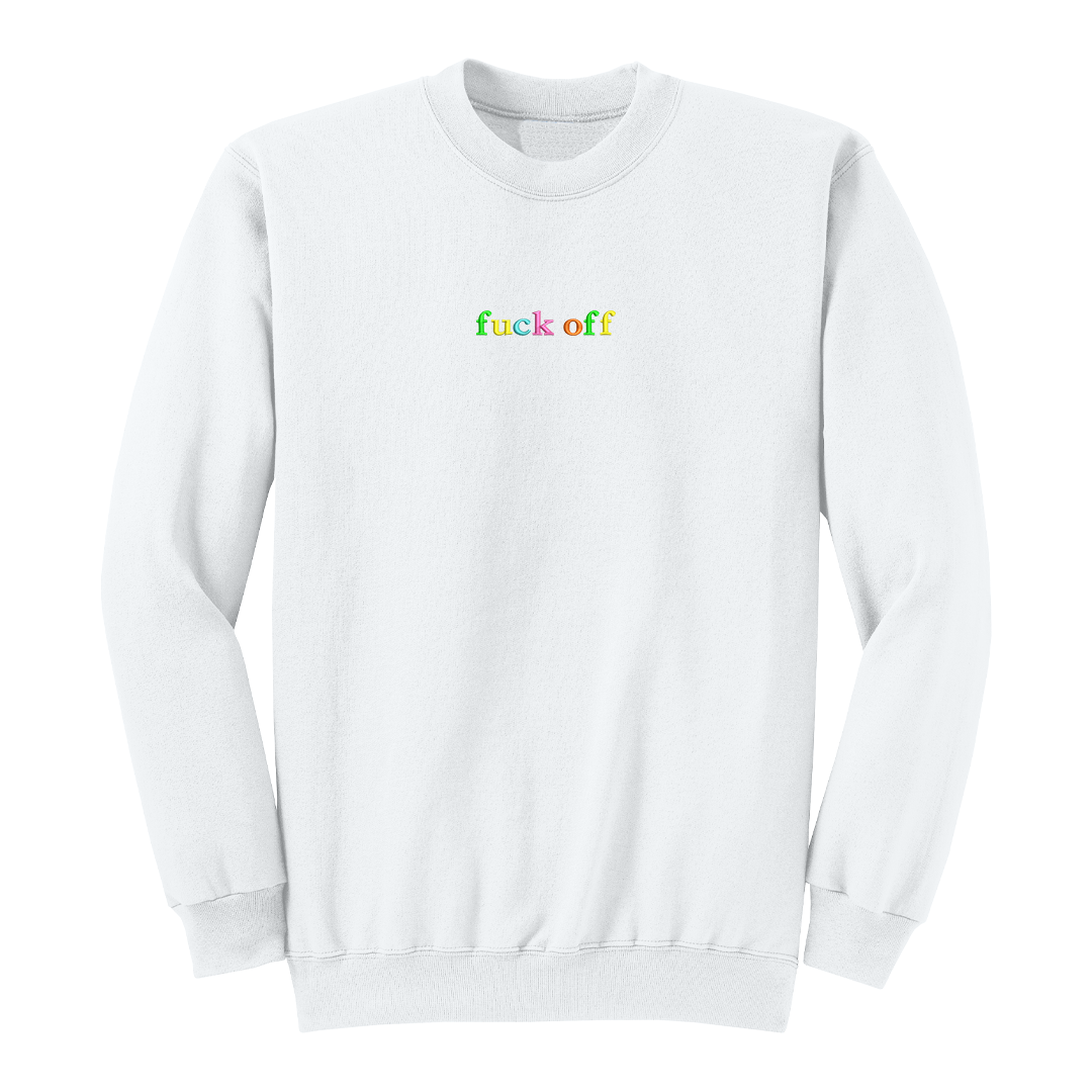 Front view of a white long sleeve crewneck featuring the phrase "fuck off" in small lowercase letters centered across the chest. Each letter is embroidered in a different bright color, creating a subtle rainbow-inspired design with a clean, minimalist aesthetic. A bold adult long sleeve shirt with colorful typography, casual streetwear style, and sarcastic humor.