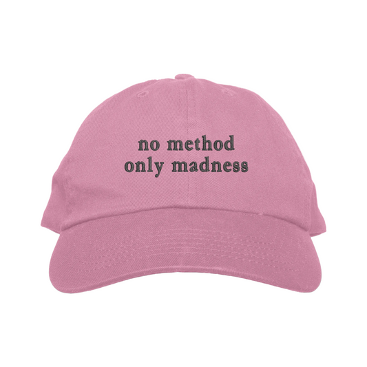 Pink cap with 'no method only madness' text on a white background