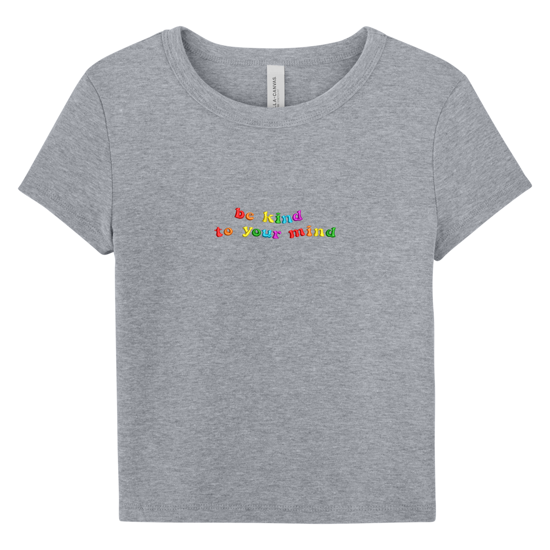 Gray baby tee with 'be kind to your mind' text in colorful letters on a white background