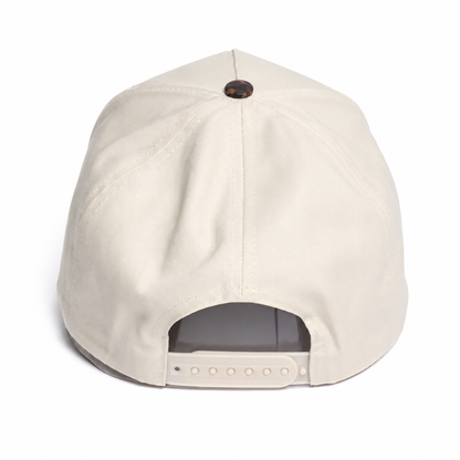 Cream snapback cap back view featuring an adjustable tonal snap closure, structured crown, and clean minimalist outdoor-inspired design.
