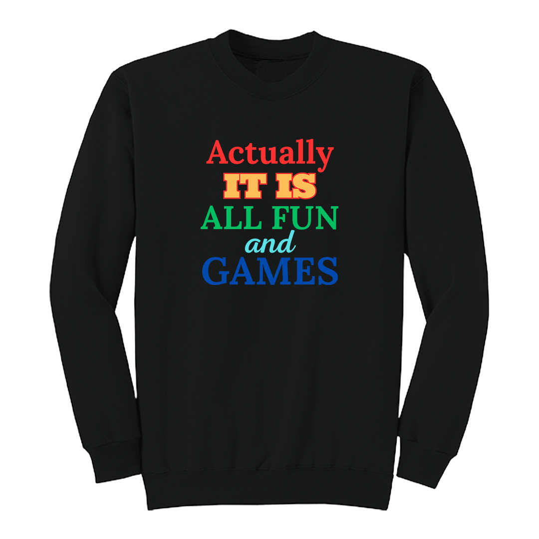 Front view of a black long sleeve graphic T-shirt featuring the phrase "Actually IT IS ALL FUN and GAMES" in stacked multicolored typography. "Actually" is red, "IT IS" is gold with a red outline, "ALL FUN" is green, "and" is written in light blue script, and "GAMES" is bold blue. This playful retro-inspired graphic long sleeve shirt is perfect for casual wear, parties, game nights, and anyone with a fun sense of humor.