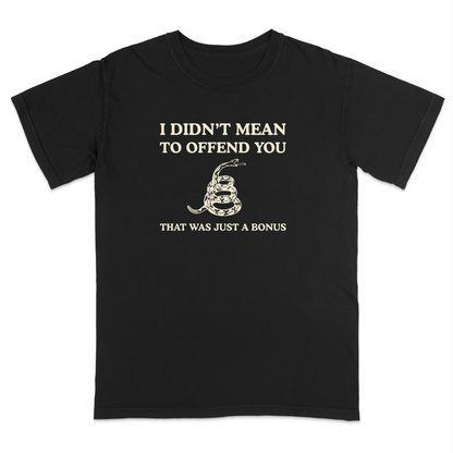 Front view of a black graphic T-shirt featuring the humorous phrase "I DIDN'T MEAN TO OFFEND YOU" above a coiled rattlesnake illustration and the text "THAT WAS JUST A BONUS." This vintage-inspired graphic tee combines bold typography with Western-style artwork for a funny, sarcastic everyday shirt.