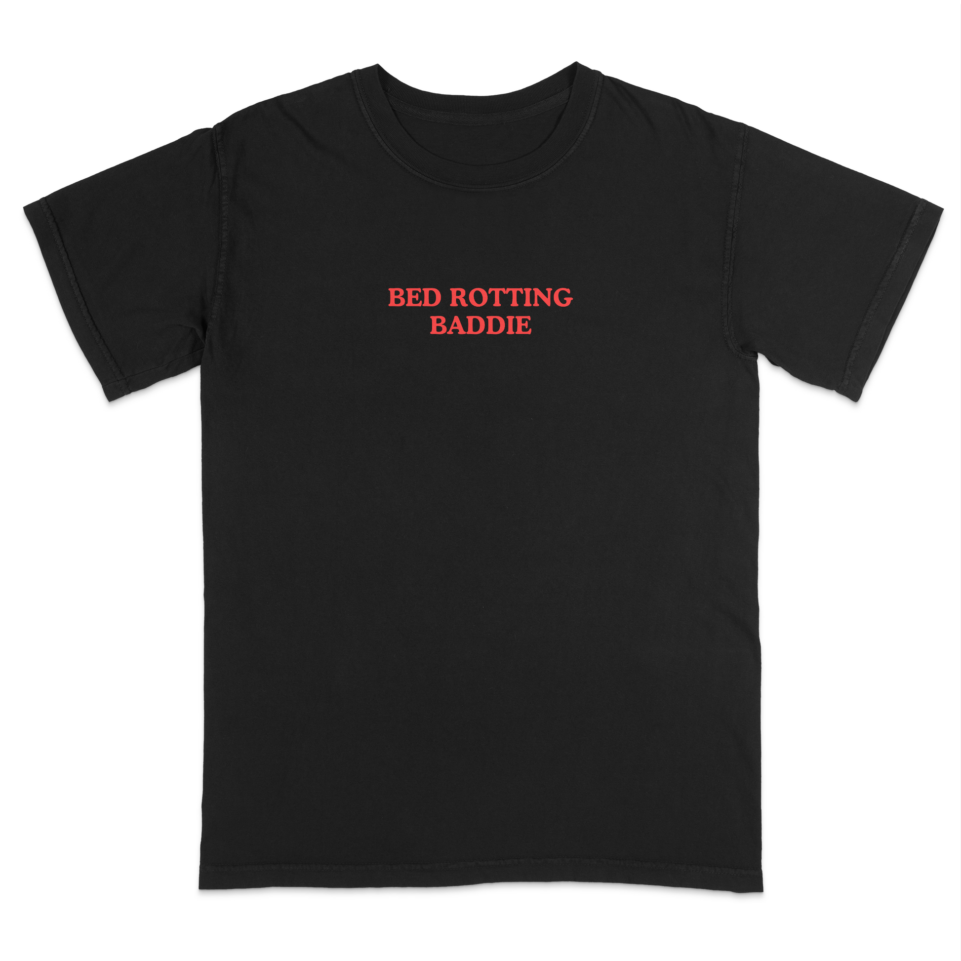 Front view of a black graphic T-shirt featuring the phrase "BED ROTTING BADDIE" in small vintage-style red lettering centered on the chest. This minimalist, trendy tee combines clean aesthetics with humorous Gen Z-inspired text for a casual everyday look.