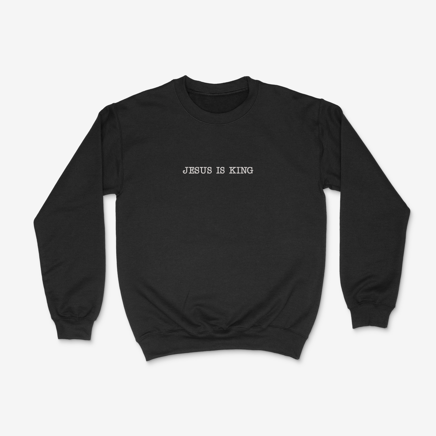 Black sweatshirt with 'Jesus is King' text on a white background