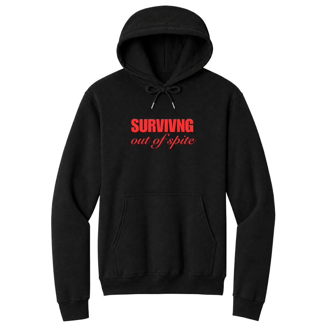 Front view of a black pullover hoodie featuring the phrase "SURVIVING" in bold red block letters above the words "out of spite" in elegant red script centered on the chest. The minimalist motivational graphic contrasts sharply against the black fabric, creating a clean, modern hoodie with a witty and resilient statement design.