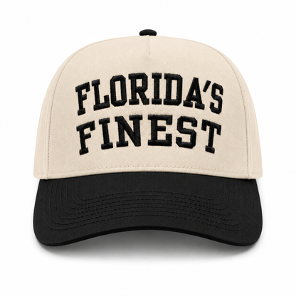 Cream and black baseball cap featuring bold black embroidered “Florida’s Finest” text on the front, contrasting black brim, and a structured crown for a classic vintage-inspired look.