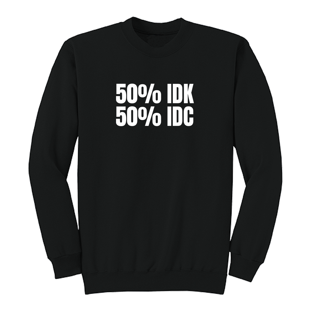Front view of a black crewneck sweatshirt featuring the bold white phrase "50% IDK 50% IDC" printed across the chest. This minimalist funny graphic sweatshirt offers a clean, modern design with a classic fit, making it perfect for casual everyday wear or gifting to someone with a sarcastic sense of humor.