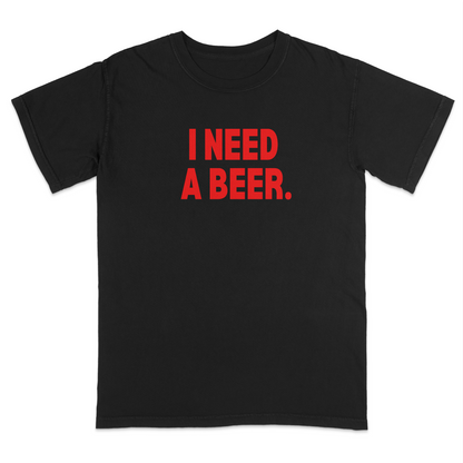 Black graphic t-shirt featuring bold red “I NEED A BEER.” text on the front, minimalist typography design, and casual humor-inspired streetwear style.