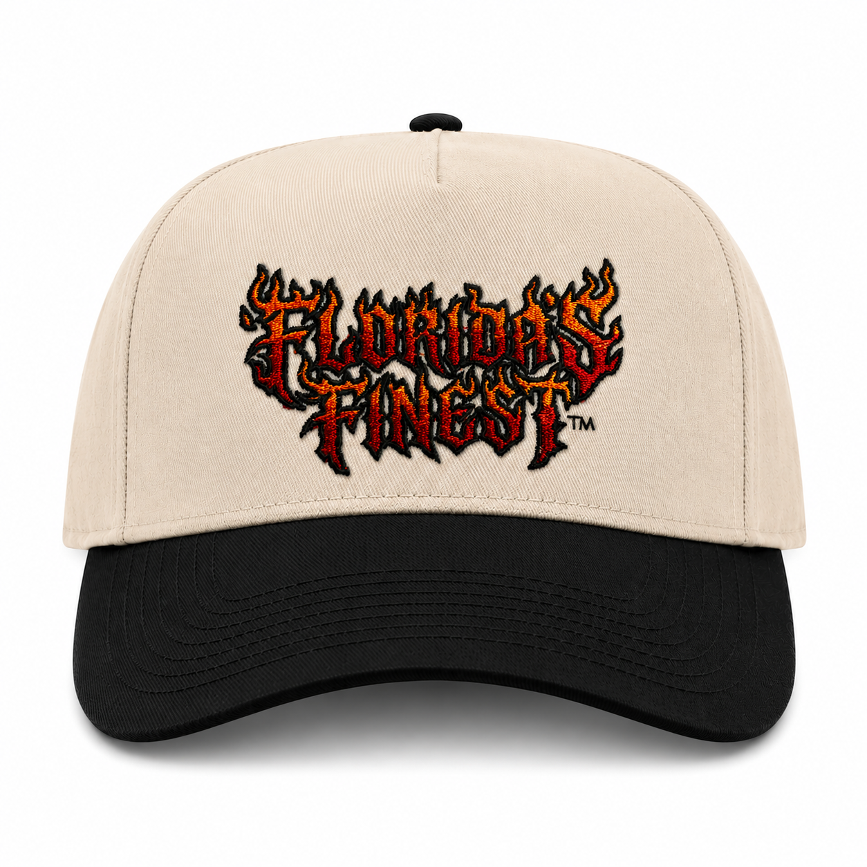 Front view of a cream and black two-tone snapback hat featuring bold embroidered "Florida's Finest™" lettering in a flame-inspired design across the front. The embroidery showcases a fiery red, orange, and black color scheme, creating a striking, edgy look. The structured cap features a cream crown, black curved brim, and matching black top button, delivering a bold statement style perfect for everyday wear and Florida-inspired streetwear.