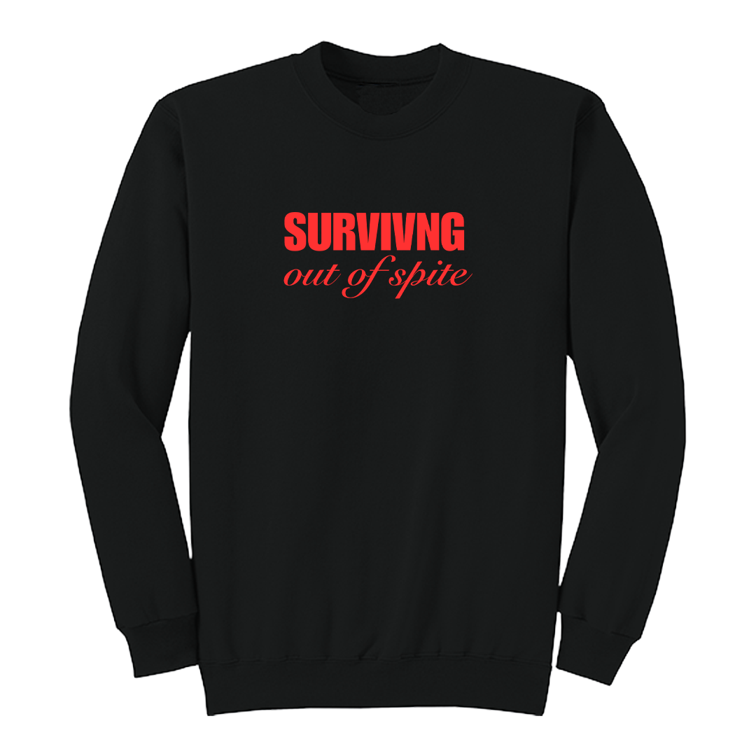 Front view of a black crewneck sweatshirt featuring the phrase "SURVIVING" in bold red block letters above the words "out of spite" in elegant red script centered on the chest. The clean, minimalist design stands out against the black fabric, creating a bold statement sweatshirt with a resilient and motivational aesthetic.