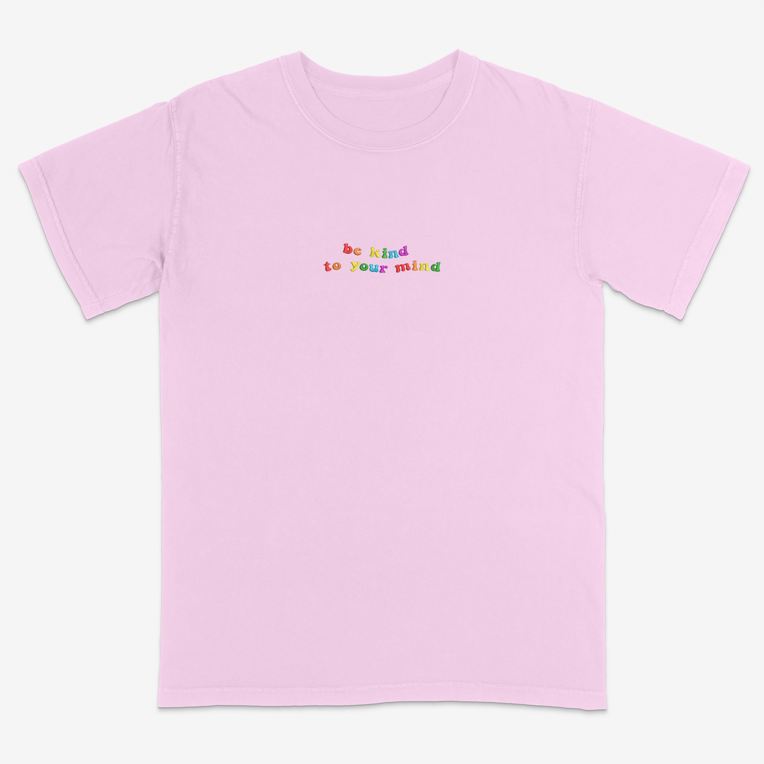 Pink t-shirt with 'be kind to your mind' text in colorful letters on a white background