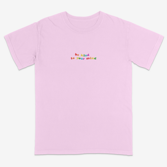 Pink t-shirt with 'be kind to your mind' text in colorful letters on a white background