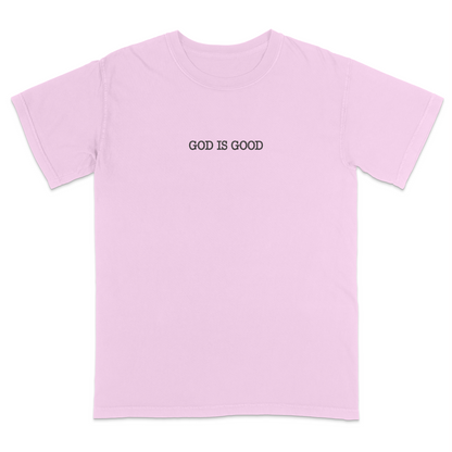 Pink t-shirt with 'GOD IS GOOD' text on a white background