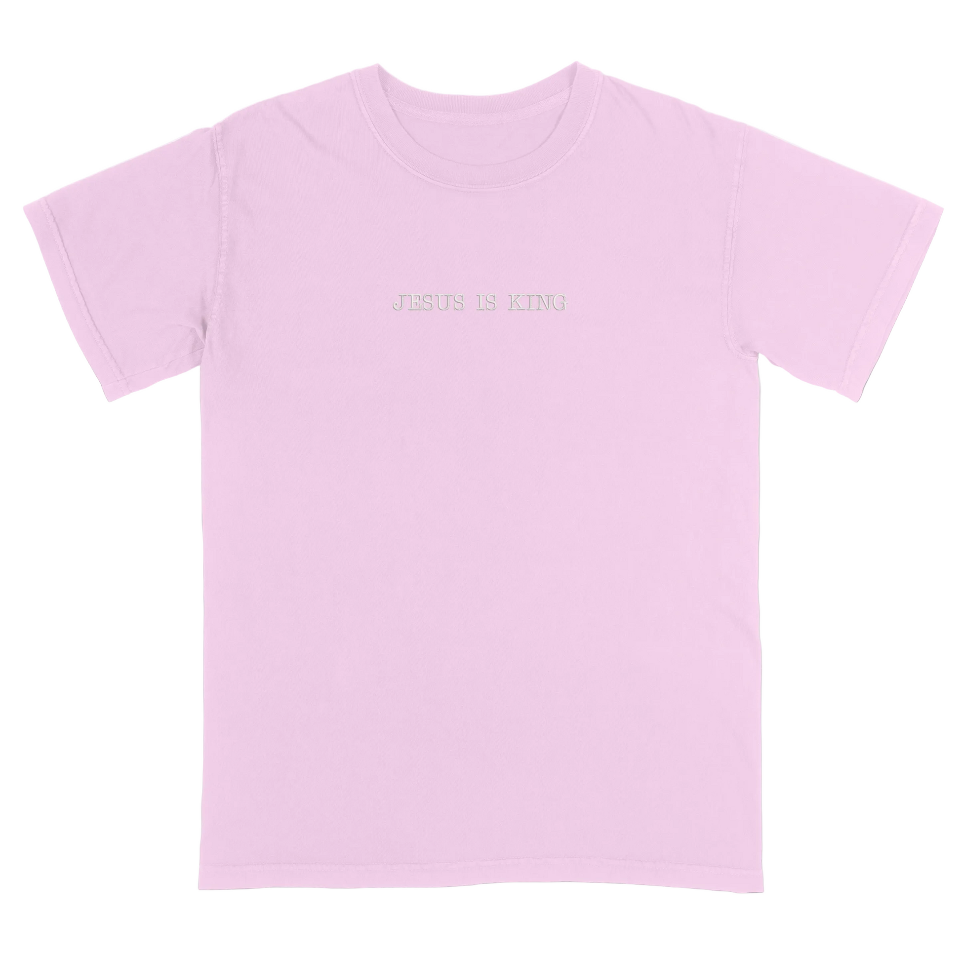 Pink t-shirt with 'Jesus Is King' text on a white background