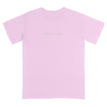 Pink t-shirt with 'Jesus Is King' text on a white background