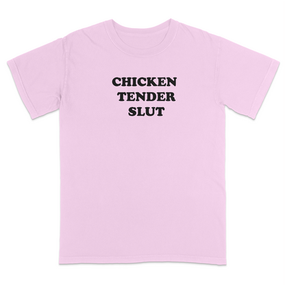Front view of a blossom graphic t-shirt featuring the bold black stacked phrase "CHICKEN TENDER SLUT" in large retro bubble lettering across the upper chest. The minimalist design uses clean vintage-inspired typography with strong contrast against the black fabric, creating a humorous foodie-themed statement tee with a playful, sarcastic aesthetic.
