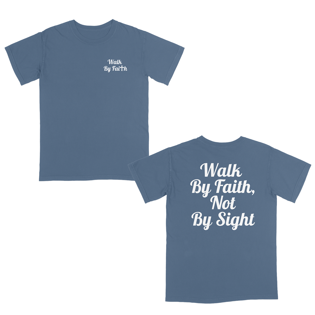 Front and back view of a blue jean faith-based graphic t-shirt featuring “Walk By Faith” text on the chest and oversized “Walk By Faith, Not By Sight” typography on the back in white script lettering.