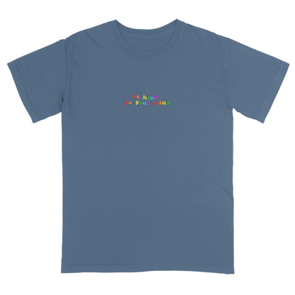 Blue t-shirt with 'be kind to your mind' text in colorful letters on a white background