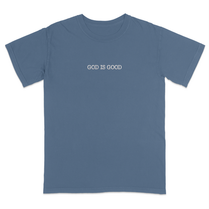 Blue t-shirt with 'GOD IS GOOD' text on a white background