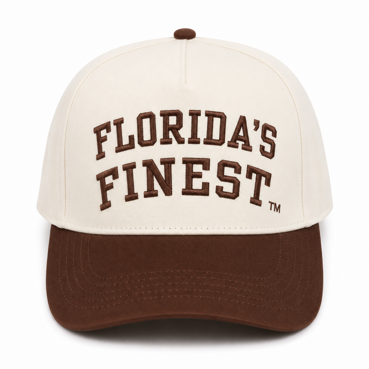 Front view of a cream snapback hat featuring raised brown "Florida's Finest" embroidery with a TM symbol and a solid brown curved bill. Displayed on a white background, highlighting the clean two-tone design and premium embroidered details.