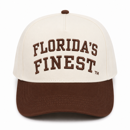 Front view of a cream snapback hat featuring raised brown "Florida's Finest" embroidery with a TM symbol and a solid brown curved bill. Displayed on a white background, highlighting the clean two-tone design and premium embroidered details.