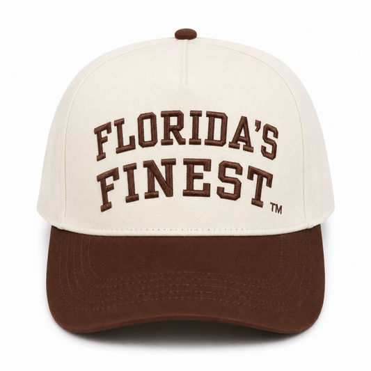 Front view of a cream snapback hat featuring raised brown "Florida's Finest" embroidery with a TM symbol and a solid brown curved bill. Displayed on a white background, highlighting the clean two-tone design and premium embroidered details.