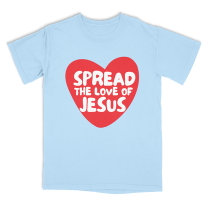 Light blue t-shirt with a red heart and white text 'Spread the Love of Jesus' on a white background