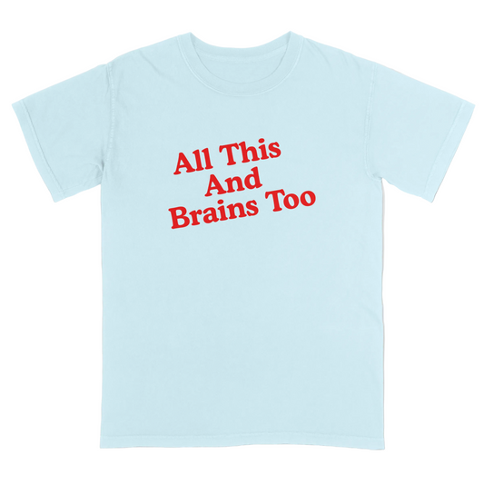 Light blue t-shirt with red text 'All This And Brains Too' on a light grey background