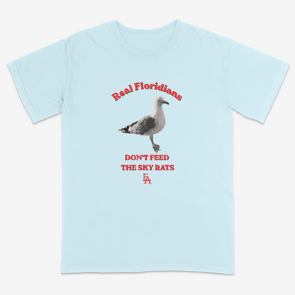 Light blue t-shirt with a seagull graphic and text on a white background
