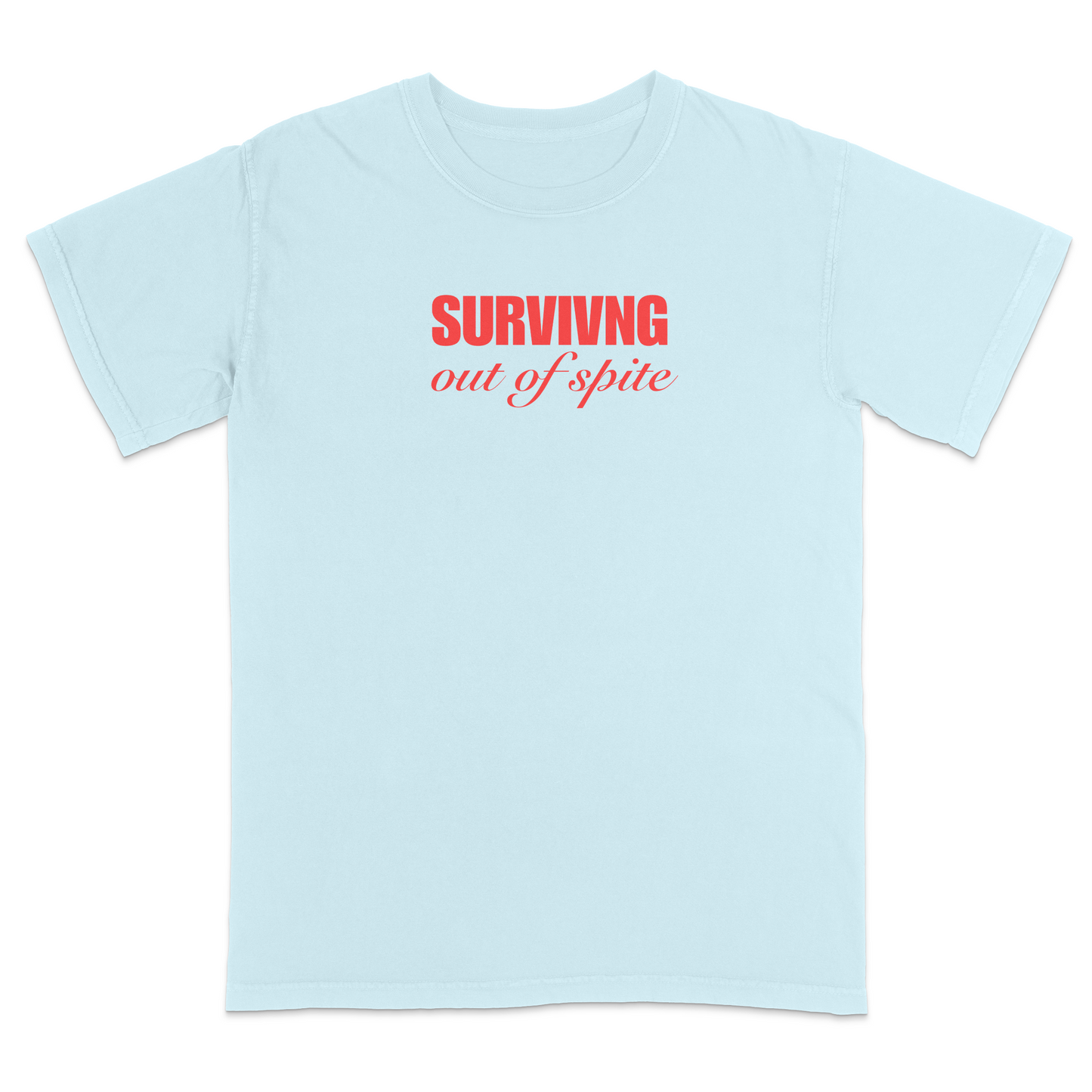 Front view of a chambray short sleeve t-shirt featuring the phrase "SURVIVING" in bold red block letters above the words "out of spite" in elegant red script centered on the chest. The minimalist red-on-black design creates a striking, resilient statement tee with a clean, modern aesthetic.