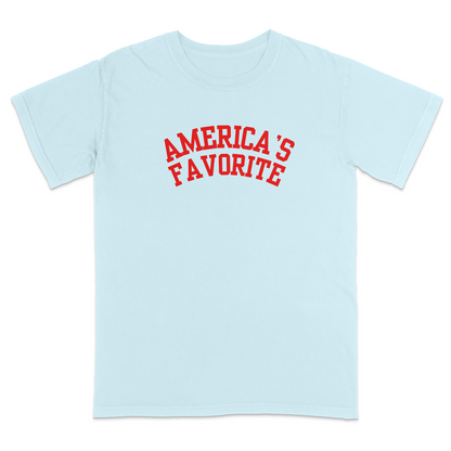 Chambray patriotic graphic tee with bold red varsity-style “America’s Favorite” lettering, featuring a clean minimalist Americana design perfect for casual Fourth of July and USA pride apparel.