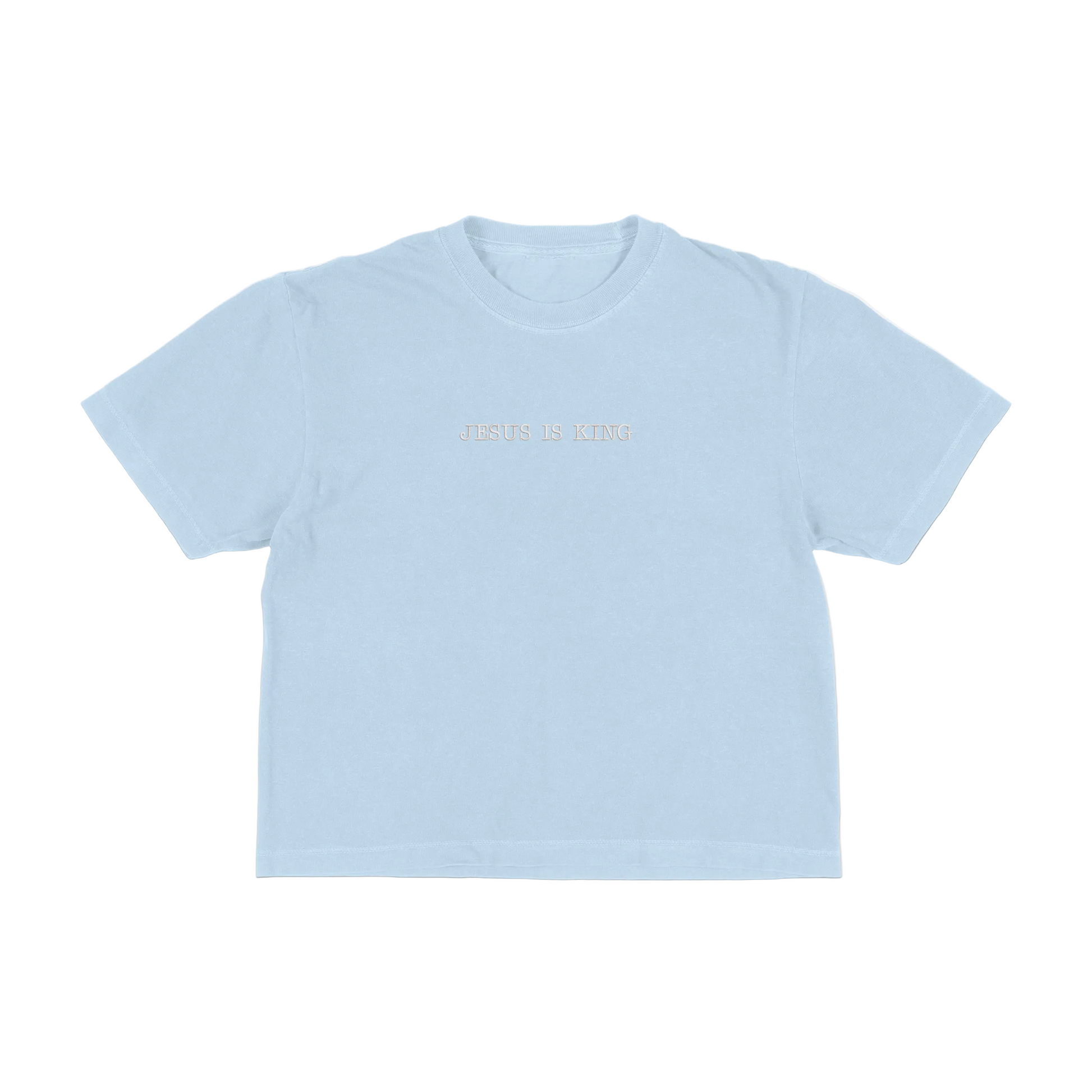 Light blue boxy tee with 'Jesus Is King' text on a white background