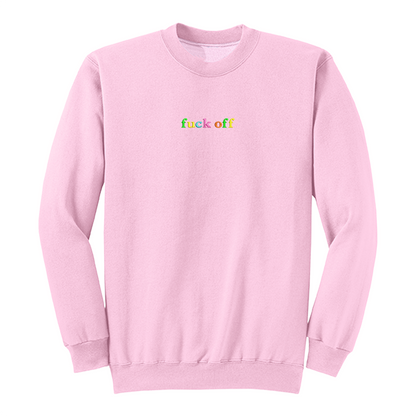 Front view of a pink long sleeve crewneck featuring the phrase "fuck off" in small lowercase letters centered across the chest. Each letter is embroidered in a different bright color, creating a subtle rainbow-inspired design with a clean, minimalist aesthetic. A bold adult long sleeve shirt with colorful typography, casual streetwear style, and sarcastic humor.