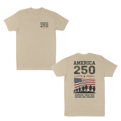 Cream patriotic America 250 t-shirt featuring a small front chest graphic and large back design with distressed American flag, military silhouettes, “1776–2026” anniversary artwork, and “Honoring Those Who Defend Our Freedom” tribute message.