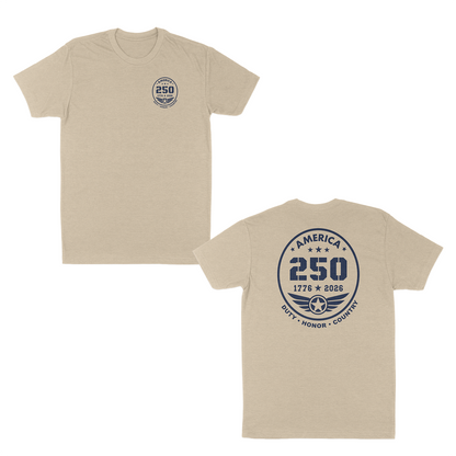 Cream patriotic America 250 anniversary t-shirt featuring a small front chest badge and large back emblem with “1776–2026” commemorative design, aviation-inspired wing graphic, and “Duty • Honor • Country” military tribute text.