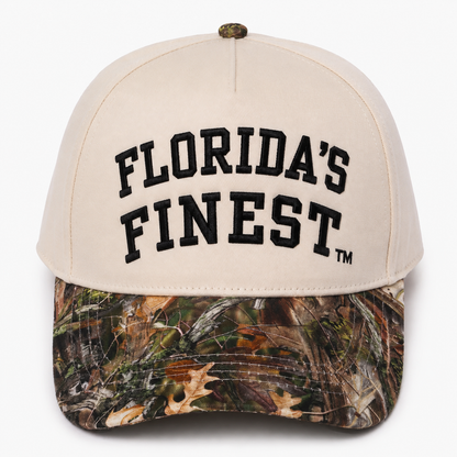 Florida’s Finest embroidered camo snapback hat featuring bold black lettering, cream crown, realistic woodland camouflage curved brim, structured fit, and outdoor-inspired Florida lifestyle design.Florida’s Finest embroidered camo snapback hat featuring bold black lettering, cream crown, realistic woodland camouflage curved brim, structured fit, and outdoor-inspired Florida lifestyle design.