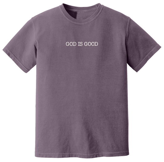 Dark purple t-shirt with 'GOD IS GOOD' text on a white background