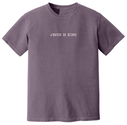 Dark purple t-shirt with 'Jesus Is King' text on a white background