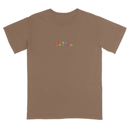 Brown t-shirt with 'be kind to your mind' text in colorful letters on a white background
