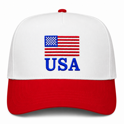 USA patriotic trucker hat featuring embroidered American flag graphic, bold blue USA lettering, white front panels, red curved bill, and classic red-white-blue Americana design.